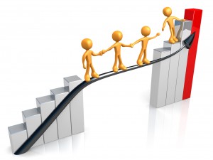 Orange Person Standing On A Silver And Red Bar Graph Chart, Reaching Back To Assist Others Up To The Top Clipart Illustration Graphic